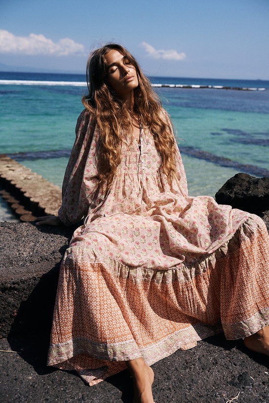 Bhoomi Maxi Dress Sunset — seated ocean backdrop, tiered hand block print cotton maxi | Daughters of India