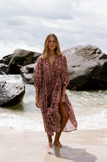 Daughters of India Kyra Midi Dress in Sumac — walking on wet sand at beach, screen print cotton