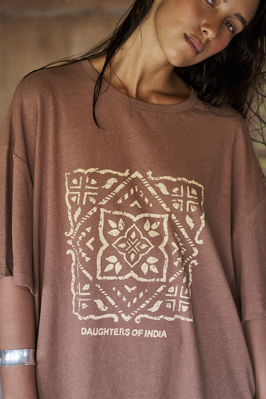 Close-up of Daughters of India Shanti Tee in Hazel showing block print geometric design on brown linen-cotton fabric